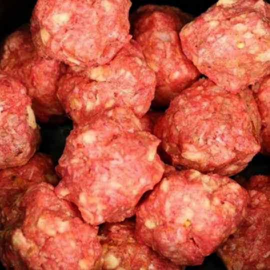 Put meatballs in a slow cooker, but the next 2 ingredients will make it special
